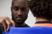 Virgil Abloh fitting a model in a Spring 2019 look.