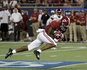 Alabama wide receiver Jaylen Waddle makes a catch for a 49-yard reception against Louisville.