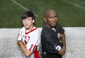 St. Paul's Episcopal quarterback AJ McCarron (left) poses with Oakland Raiders quarterback JaMarcus Russell on June 28, 2008, at Ladd-Peebles Stadium in Mobile.