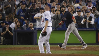 Boston Red Sox's Mitch Moreland watches his three-run home run off Los Angeles Dodgers relief pitcher Ryan Madson during the seventh inning in Game 4 of the World Series baseball game on Saturday, Oct. 27, 2018, in Los Angeles. (AP Photo/Mark J. Terrill)
            