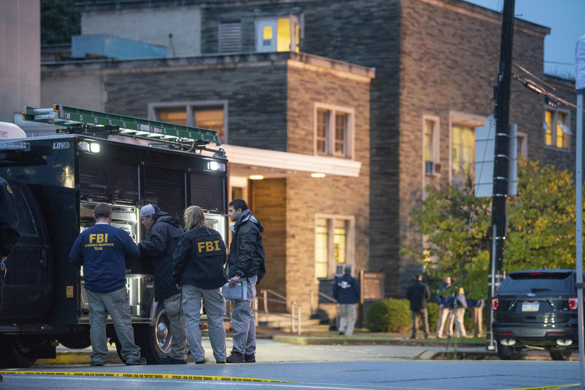 The FBI investigates after an active shooter situation at the Tree of Life Congregation on Saturday, Oct. 27, 2018, in the Squirrel Hill section of Pittsburgh. A shooter opened fire at the synagogue, killing multiple people and injuring others in one of the deadliest attacks on Jews in U.S. history.  (Andrew Stein/Pittsburgh Post-Gazette via AP)
            