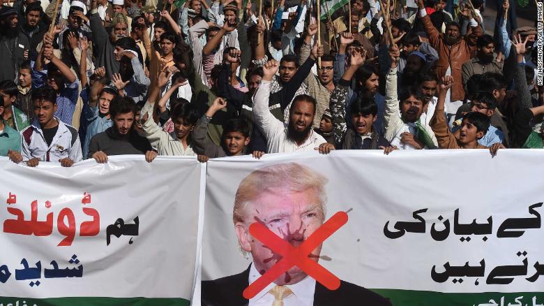 Activists of the Difa-e-Pakistan Council shout anti-US slogans at a protest in Karachi on January 2, 2018. 
Pakistan has summoned the US ambassador, an embassy spokesman said January 2, in a rare public rebuke after Donald Trump lashed out at Islamabad with threats to cut aid over &quot;lies&quot; about militancy. / AFP PHOTO / ASIF HASSAN        (Photo credit should read ASIF HASSAN/AFP/Getty Images)