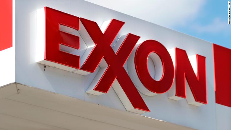 This April 25, 2017, photo, shows an Exxon service station sign in Nashville, Tenn. On Wednesday, May 31, 2017, Exxon Mobil shareholders pushed the company to share more information about whether regulations designed to reduce climate change will hurt the oil giant&#39;s business. 