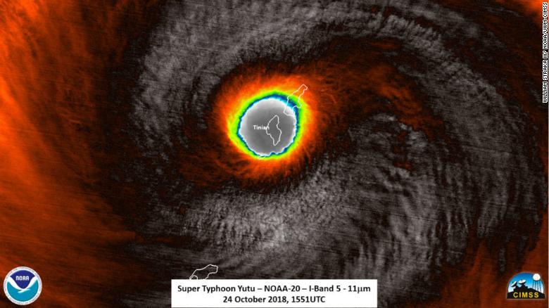 Satellite image provided by the National Oceanic and Atmospheric Administration shows Super Typhoon Yutu passing over Tinian island, one of the three principle islands of the Northern Mariana Islands.