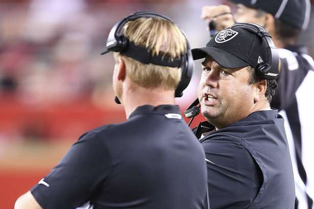 Oakland Raiders defensive coordinator Paul Guenther, right, talks with head coach Jon Gruden during the second half of an NFL football game against the San Francisco 49ers in Santa Clara, Calif., Thursday, Nov. 1, 2018. (AP Photo/Ben Margot)