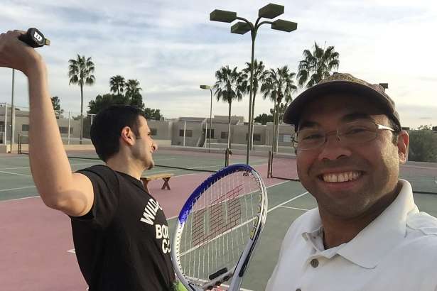 Farhan Zaidi, right, poses for a photo with his brother, Jaffer, before playing a tennis match in Arizona in 2015. The two play tennis every year during baseball's spring training. On this visit, Jaffer was diagnosed with cancer, but they still played their match.