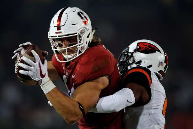 PALO ALTO, CA - NOVEMBER 10: Tight end Colby Parkinson #84 of the Stanford Cardinal catches a pass for a touchdown past cornerback Dwayne Williams #4 of the Oregon State Beavers during the first quarter at Stanford Stadium on November 10, 2018 in Palo Alto, California. (Photo by Jason O. Watson/Getty Images)