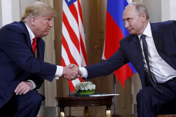 FILE - In this Monday, July 16, 2018, file photo, U.S. President Donald Trump, left, and Russian President Vladimir Putin shake hands at the beginning of a meeting at the Presidential Palace in Helsinki, Finland. As Americans prepare for another election, Russian troublemakers appear to laboring afresh to divide U.S. voters and discredit democracy, and perhaps even sway the outcome. (AP Photo/Pablo Martinez Monsivais, File)