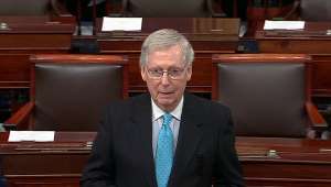 Mitch McConnell wearing a suit and tie