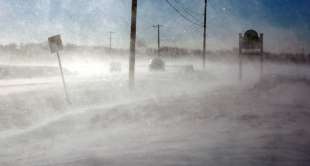 Drifting snow blows across a road near Mount Joy in Lancaster County, Pa. Wednes...