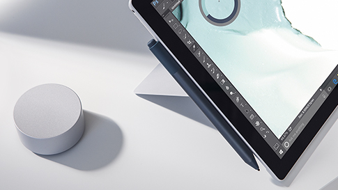 Surface Pro with a Surface dial next to it