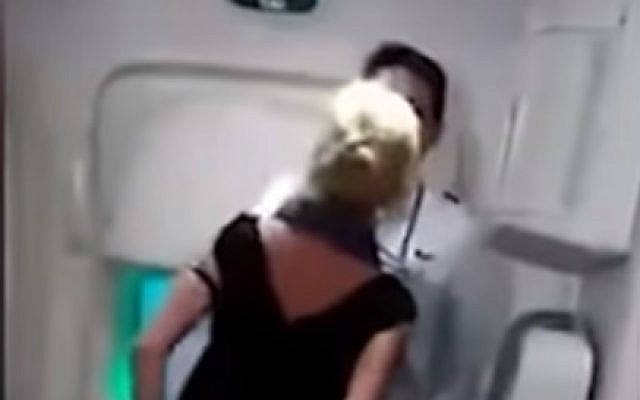 Screen capture from video of rights activist and international lawyer Simone O’Broin, during an altercation on an Air India flight. (YouTube)