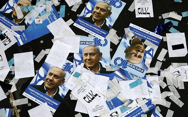 Likud Party campaign material and posters of Prime Minister Benjamin Netanyahu strewn on the floor following election night at the party headquarters Tel Aviv, April 10, 2017. (Jack GUEZ/AFP)