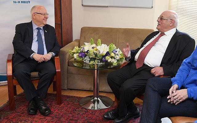 President Reuven Rivlin (L) meets with Supreme Court Justice Hanan Melcer, the head of the Central Elections Committee, in Jerusalem on April 10, 2019. (Mark Neiman/GPO)