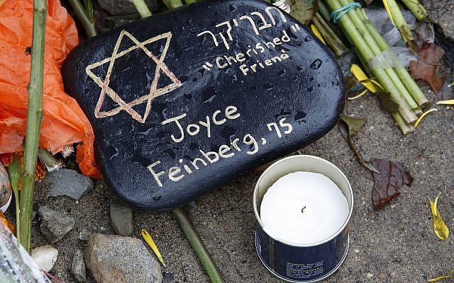 A stone at a makeshift memorial outside the Tree of Life Synagogue to the 11 people killed Oct 27, 2018 while worshipping in the Squirrel Hill neighborhood of Pittsburgh Nov. 1, 2018. (AP Photo/Gene J. Puskar)