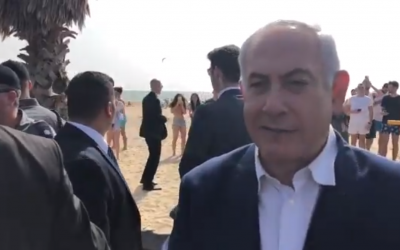 Prime Minister Benjamin Netanyahu in a campaign video filmed at a beach in the coastal city of Netanya on April 9, 2019. (Screen capture: Twitter)