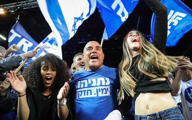 Likud party supporters celebrate as the results in the Israeli general elections are announced, at the party headquarters in Tel Aviv, on April 09, 2019 (Noam Revkin Fenton/FLASH90)