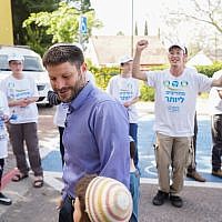 Union of Right Wing Parties MK Bezalel Smotrich walks into a polling station in the northern West Bank settlement of Kedumim on April 9, 2019. (Hillel Maeir/Flash90)