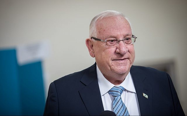 President Reuven Rivlin speaks with the press after casting his ballot at a voting station in Jerusalem, during elections for the Knesset, on April 9, 2019. (Hadas Parush/Flash90)