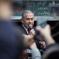 Prime Minister Benjamin Netanyahu seen during an election campaign tour in the Mahane Yehuda market in Jerusalem, April 8, 2019. (Hadas Parush/Flash90)