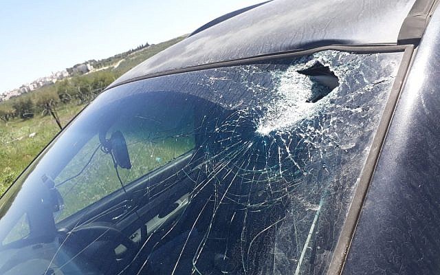 Israeli car damaged by a hammerhead, April 10, 2019, near the West Bank settlement of Tekoa. (Rescuers Without Borders)