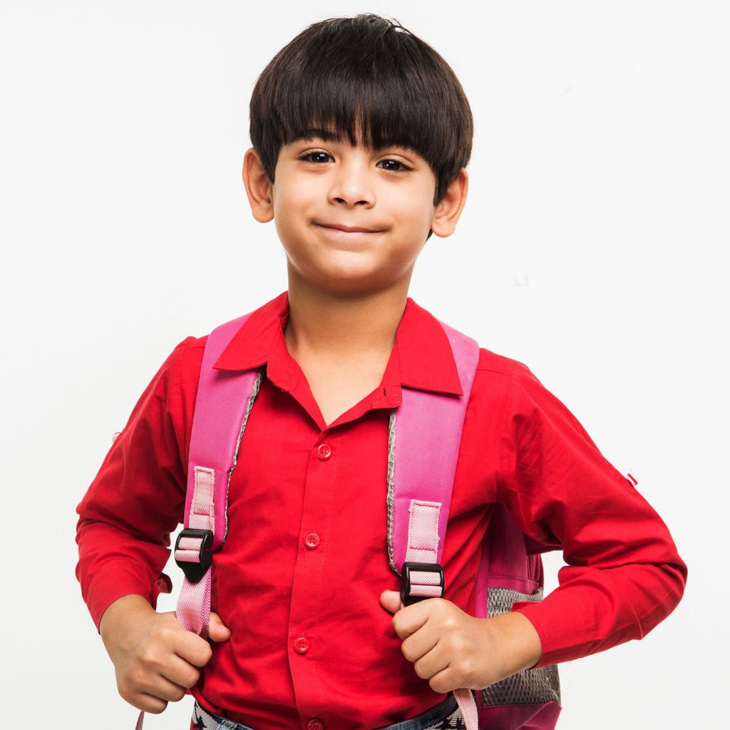 Young boy with school backpack.