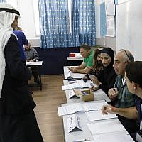 An Arab Israeli man prepares to vote in Israel's parliamentary elections on April 9, 2019 at a school-turned-polling station in the northern Israeli town of Taibe. (Ahmad Gharabli/AFP)