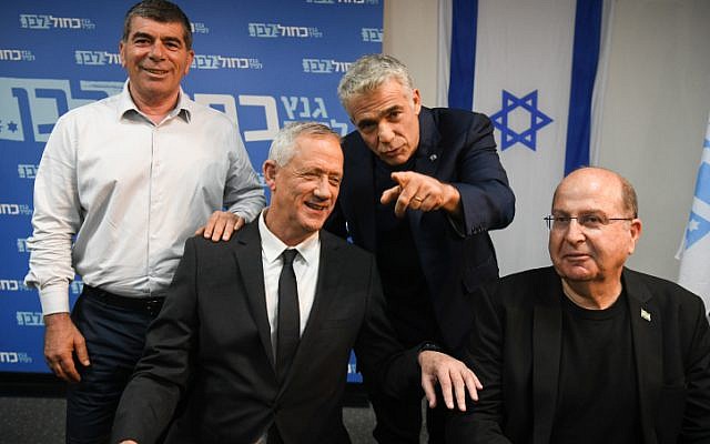 Members of the Blue White political party Benny Gantz (2L), Boogie Yaalon, Gabi Ashkenazi and Yair Lapid hold a press conference at the party headquarters in Tel Aviv, on April 10, 2019. (Flash90)