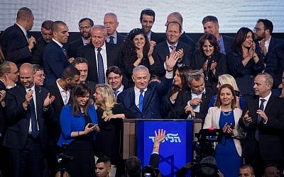 Prime Minister Benjamin Netanyahu, surrounded by Likud politicians and his wife Sara, addresses his supporters as the the results of the Israeli general elections are announced, at the party headquarters in Tel Aviv, in the early hours of April 10, 2019. (Yonatan Sindel/FLASH90)
