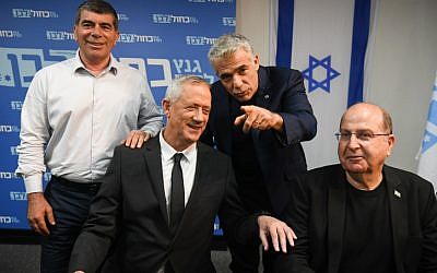 Members of the Blue White political party Benny Gantz (2L), Boogie Yaalon, Gabi Ashkenazi and Yair Lapid hold a press conference at the party headquarters in Tel Aviv, on April 10, 2019. (Flash90)