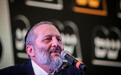 Aryeh Deri, head of the Shas party, greets supporters as the results in the Israeli general elections are announced at the party headquarters in Jerusalem, April 09, 2019. (Flash90)