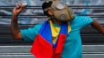 Venezuela protests: 27-year-old woman dies in rioting; 24 injured in May Day clashes between Juan Guaido supporters and military forces