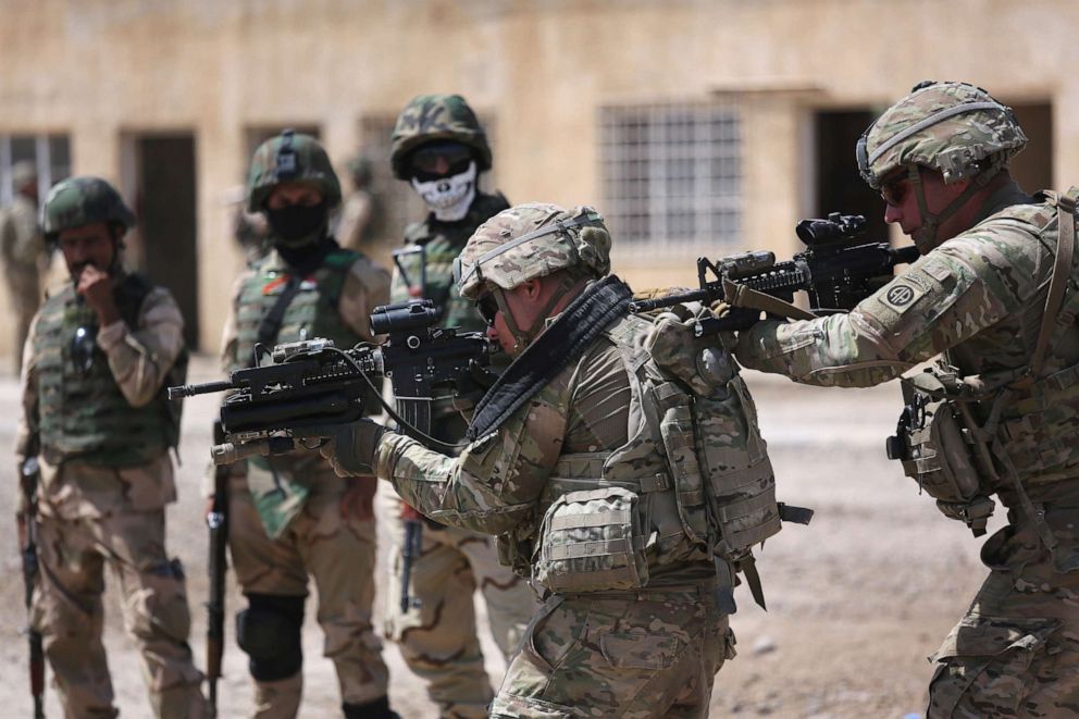 PHOTO: U.S. Army trainers instruct Iraqi Army recruits at a military base on April 12, 2015 in Taji, Iraq.