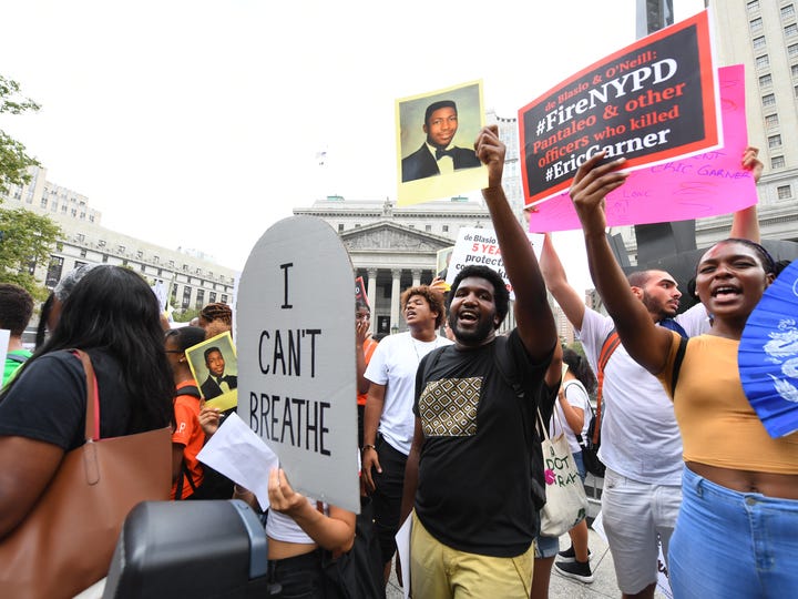 Activists hold a rally in Foley Square in New York City on July 17, 2019. The Department of Justice announced the day before that New York Officer Daniel Pantaleo would not face federal charges in Garner's death.