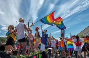 A rainbow flag waving at a pride festival
