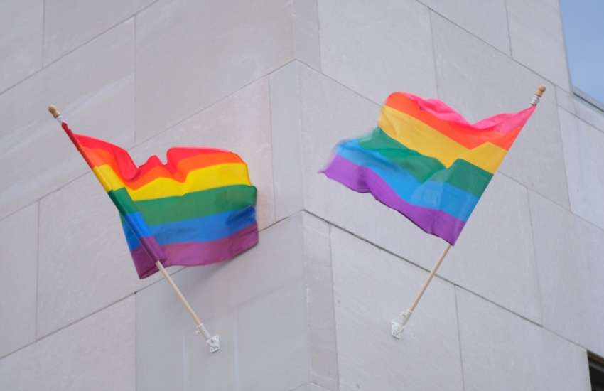 Pride flags outside the Romney building in Michigan in June