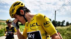 Burning issue: Geraint Thomas washes out his eyes after police spray lingered in the air