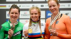 (L-R) Silver medalist Ireland's Lydia Boylan, winner Australia's Alexandra Manly and third placed Kirsten Wild of The Netherlands' celebrate during the award ceremony for the Women's Point Race at the UCI Track Cycling World Championships in Pruszkow