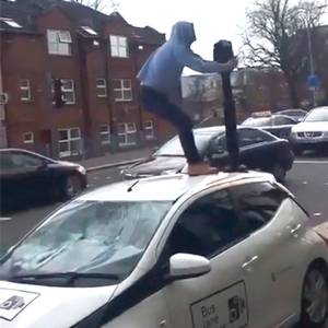 Gerard Donegan on the Falls road west Belfast attacking a bus lane camera car.