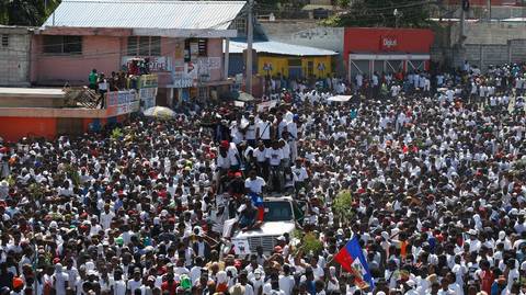 Haitian artists lend voice to president resignation demands, leading a mass protest