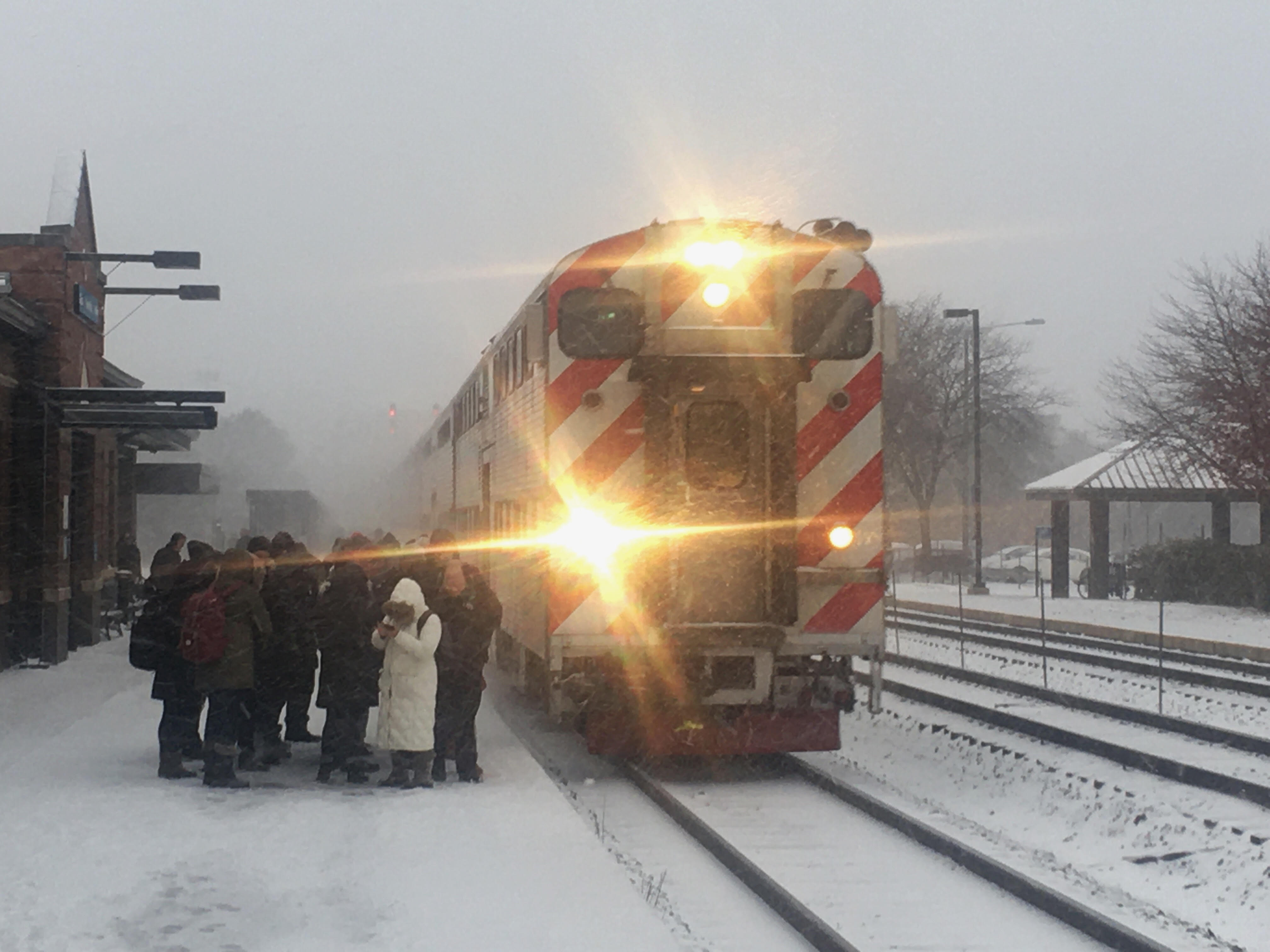 Temperatures will plummet as low as 12 degrees Nov. 12, 2019, the National Weather Service said. Commuters bundle up at a Metra station in Naperville.