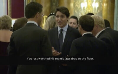 Screen capture from video of Canadian Prime Minister Justin Trudeau (C), standing in a huddle with French President Emmanuel Macron (C-R), British Prime Minister Boris Johnson,(R), Dutch Prime Minister Mark Rutte (C-L), and Britain’s Princess Anne, during a NATO reception party at Buckingham Palace, December 3, 2019. (Host Broadcaster via AP)