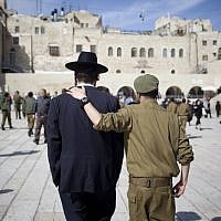 Soldier and ultra-Orthodox man, shoulder to shoulder (Yonatan Sindel/Flash90)