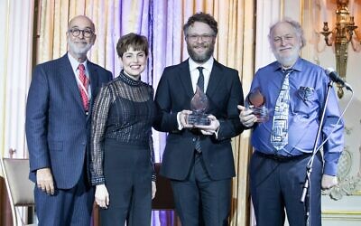 From left: Rich Rumelt, the board president of The Workers Circle; Ann Toback, the group's executive director; Seth Rogen; and Mark Rogen at the organization's ceremony in New York City, Dec. 2, 2019. (Mark Stephen Kornbluth via JTA)