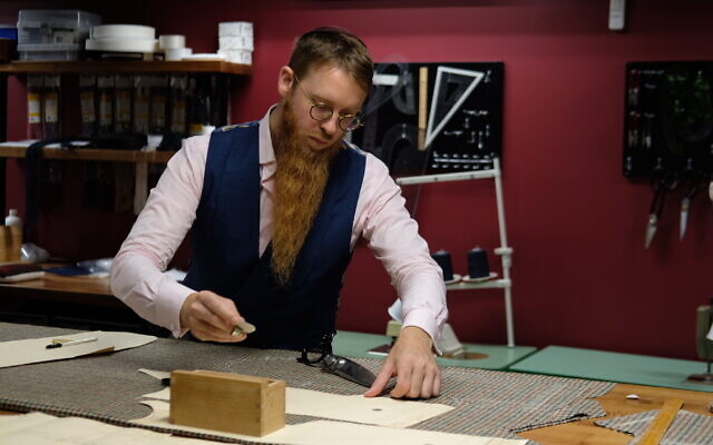 Yosel Tiefenbrun works at his bespoke tailoring house in Williamsburg, Brooklyn. (Courtesy of Tiefenbrun)