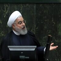 Iran's President Hassan Rouhani delivers a speech to present the budget for the financial year starting late March 2020 to the parliament in Tehran on December 8, 2019. (STR/AFP)