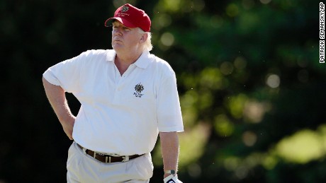 FILE - In this June 27, 2012, file photo, Donald Trump stands on the 14th fairway during a pro-am round of the AT&amp;T National golf tournament at Congressional Country Club in Bethesda, Md. A set of golf clubs that Trump gifted to a former caddie before becoming president is being auctioned off. Boston-based RR Auction says Trump used the TaylorMade RAC TP ForgedIrons clubs at the Trump National Golf Club in Bedminster, New Jersey. (AP Photo/Patrick Semansky, File)