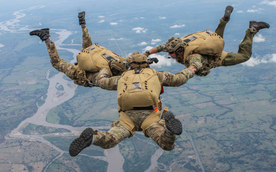 U.S. Air Force pararescuemen jump out of a Colombian Costa 295 aircraft during a multi-national jump with Colombian, Peruvian and Dominican special operations forces during exercise Angel de los Andes, Sept. 4, 2018. Angel de los Andes is a search and rescue exercise hosted by Colombia involving 12 partner nations working together in a multi-national environment and focuses on exercising search and rescue, aeromedical evacuation and casualty evacuation operations. (Courtesy Photo)