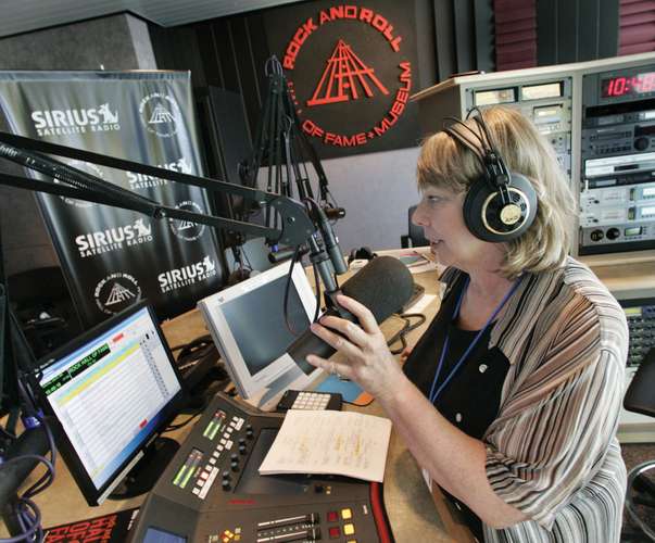A disc jockey delivering the Sirius Satellite Radio service's first live broadcast, from the Rock and Roll Hall of Fame and Museum, Cleveland, Ohio, July 2005.