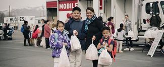 Mother and three children at mobile food pantry